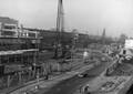154454, Gezicht op de Moreelselaan te Utrecht met rechts het Stationsplein. Op de achtergrond het oude N.S.-station Utrecht C.S. en links het in aanbouw zijnde nieuwe Centraal Station., Nederlandse Spoorwegen, fotograaf