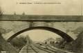 2 - LUSIGNAN (Vienne) - Le pont de la route de Gazeneuil et la gare - Editeur : Angevin.