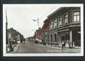 Jemeppe-sur-Meuse - Rue de la Station. Photo véritable. Animation, magasins, voitures,...