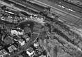 120342, Luchtfoto van het N.S.-station Amersfoort aan het Stationsplein te Amersfoort, uit het zuidoosten, met links op de voorgrond de Regentesselaan., Vliegbasis Soesterberg/ Foto-technische dienst legerluchtmacht, fotograaf