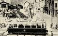 GRENOBLE (Isère) - Un tramway traverse les voies de la gare de la SNCF vers 1950.