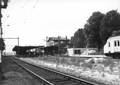 155860, Gezicht op het N.S.-station Harderwijk te Harderwijk kort voor de afbraak. Rechts is het nieuwe stationsgebouw in aanbouw., Mochèl, E., fotograaf