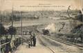 GIVET (Ardennes) - Un train débouche du tunnel sous le Fort de Charlemont, à l'entrée de la gare.